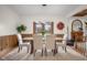 Elegant dining room with a glass table, seating for six and view of fireplace at 6043 Acorn Dr, Columbus, IN 47201