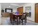 Open concept dining room with views of the home movie area in the basement at 6043 Acorn Dr, Columbus, IN 47201
