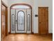 Elegant entryway showcasing decorative glass doors and hardwood floors, creating a grand entrance at 6043 Acorn Dr, Columbus, IN 47201