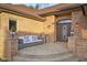 Inviting front porch features a seating area and decorative plants, creating a welcoming entrance at 6043 Acorn Dr, Columbus, IN 47201
