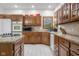 Charming kitchen featuring wooden cabinets, granite countertops, and modern appliances at 6043 Acorn Dr, Columbus, IN 47201