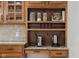 Built-in hutch, shelving with small appliances and books, and tile backsplash at 6043 Acorn Dr, Columbus, IN 47201