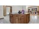 Kitchen island with granite countertop, cooktop, and storage cabinets at 6043 Acorn Dr, Columbus, IN 47201