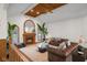 Inviting living room with vaulted ceilings, fireplace, and leather sofas at 6043 Acorn Dr, Columbus, IN 47201