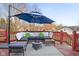 Cozy outdoor seating with plush cushions and umbrella on wooden deck at 6043 Acorn Dr, Columbus, IN 47201