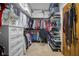 Well-organized walk-in closet with extensive hanging space and storage solutions for clothes, belts, and shoes at 6043 Acorn Dr, Columbus, IN 47201