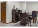 Spacious wet bar featuring wine storage and comfortable seating at 6043 Acorn Dr, Columbus, IN 47201