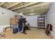 Spacious basement featuring a Peloton and storage shelves at 6721 Evanston Ave, Indianapolis, IN 46220