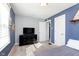 Bedroom featuring a dark dresser, white doors, and neutral grey walls at 6721 Evanston Ave, Indianapolis, IN 46220