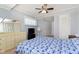 Primary bedroom features a ceiling fan and tv with natural light coming through the window at 6721 Evanston Ave, Indianapolis, IN 46220