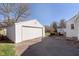 Detached one car garage with white door and driveway at 6721 Evanston Ave, Indianapolis, IN 46220