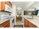 Well-equipped kitchen with granite counters and modern appliances, open to the dining area at 6721 Evanston Ave, Indianapolis, IN 46220