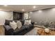 Finished basement with cozy couch, chalk board, and recessed lighting at 7021 Warwick Rd, Indianapolis, IN 46220