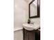 Bathroom featuring a vessel sink and white wainscotting at 7021 Warwick Rd, Indianapolis, IN 46220