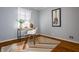Bright bedroom office nook featuring wood floors and a patterned rug at 7021 Warwick Rd, Indianapolis, IN 46220