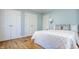 Bright bedroom boasts hardwood floors, two closets, and soft blue walls at 7021 Warwick Rd, Indianapolis, IN 46220