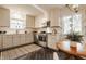 Bright kitchen with stainless steel appliances, white cabinets, hardwood floors and plenty of storage at 7021 Warwick Rd, Indianapolis, IN 46220