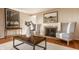 Warm living room featuring a fireplace, unique coffee table and stylish decor at 7021 Warwick Rd, Indianapolis, IN 46220