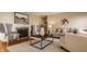 Bright living room featuring a fireplace, neutral furniture and lots of natural light at 7021 Warwick Rd, Indianapolis, IN 46220