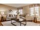 Inviting living room with comfortable seating, decorative pillows, and hardwood floors at 7021 Warwick Rd, Indianapolis, IN 46220