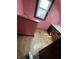 A bathroom with pink walls and a dark wood vanity is shown at 805 W 3Rd St, Alexandria, IN 46001