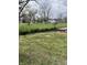 The front yard features a well-maintained lawn and lush greenery at 805 W 3Rd St, Alexandria, IN 46001