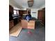 Kitchen with wooden cabinets, black appliances, a kitchen island, and laminate flooring at 805 W 3Rd St, Alexandria, IN 46001