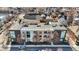 An aerial shot showcases townhome's roof and surrounding neighborhood, providing a sense of the property's location and community at 932 Broadway St # 15, Indianapolis, IN 46202