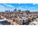 Stunning aerial view of the city skyline and the surrounding neighborhood with a mix of residential buildings and greenery at 932 Broadway St # 15, Indianapolis, IN 46202