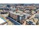Wide aerial shot of the neighborhood's diverse housing options, from cozy homes to modern condos, near shopping at 932 Broadway St # 15, Indianapolis, IN 46202