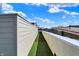 A long and spacious balcony with faux grass is great for entertaining at 932 Broadway St # 15, Indianapolis, IN 46202