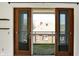 Balcony showing indoor/outdoor living with view of neighboring house and turf flooring at 932 Broadway St # 15, Indianapolis, IN 46202
