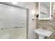 Bathroom featuring modern vanity with vessel sink and glass enclosed shower at 932 Broadway St # 15, Indianapolis, IN 46202