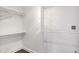 Walk-in closet with shelving and clothes rods, providing ample storage space at 932 Broadway St # 15, Indianapolis, IN 46202