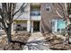 Inviting entryway with covered porch, sleek walkway, and well-maintained landscaping for a welcoming first impression at 932 Broadway St # 15, Indianapolis, IN 46202