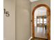 Inviting entryway featuring a gorgeous wood doorway leading into a bright, open floorplan at 932 Broadway St # 15, Indianapolis, IN 46202