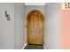 Unique entryway featuring a rustic wooden door, complemented by slate tile flooring, adding character and charm at 932 Broadway St # 15, Indianapolis, IN 46202