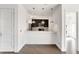 A bright, white kitchen features recessed lighting and stainless steel appliances at 932 Broadway St # 15, Indianapolis, IN 46202