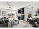 Open-concept living room featuring contemporary decor and a stylish fireplace at 932 Broadway St # 15, Indianapolis, IN 46202