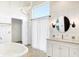 Bathroom featuring a soaking tub, walk-in shower, and decorative lighting at 932 Broadway St # 15, Indianapolis, IN 46202