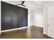 Spacious bedroom features a ceiling fan and an elegant shiplap accent wall at 932 Broadway St # 15, Indianapolis, IN 46202