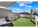 A rooftop deck with faux grass creates a beautiful outdoor living space at 932 Broadway St # 15, Indianapolis, IN 46202