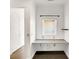 Study area with a built-in desk, hardwood floors and a large window at 932 Broadway St # 15, Indianapolis, IN 46202