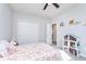 Bright bedroom with double door closet, ceiling fan and a sunlit window at 981 Mound St, Bargersville, IN 46106