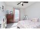 bedroom with a bright window, ceiling fan, and playful decor at 981 Mound St, Bargersville, IN 46106