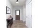 Inviting entryway with hardwood floors, a stylish console table, and a view of the front door at 981 Mound St, Bargersville, IN 46106