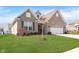 Attractive single-story brick home with a well-kept lawn and a two-car garage at 981 Mound St, Bargersville, IN 46106