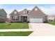 Charming single-story brick home with attached two-car garage and well-manicured lawn at 981 Mound St, Bargersville, IN 46106