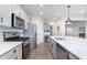 Contemporary kitchen boasting stainless steel appliances, a spacious island, and a pantry at 981 Mound St, Bargersville, IN 46106
