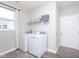 Bright laundry room with washer, dryer, window and shelving at 981 Mound St, Bargersville, IN 46106